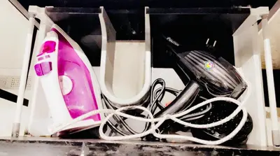 a pink and black hair dryer in a box at Les princesses studio confortable in Maarif