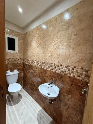 a bathroom with a toilet and a sink at Charming 1 bedroom apartment Ocean living room, Rabat in Rabat