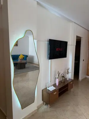 a mirror on the wall of a living room at Charming 1 bedroom apartment Ocean living room, Rabat in Rabat