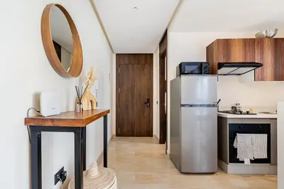 a kitchen with a stainless steel refrigerator and a counter at Centrale studio with Nice terasse in Maarif