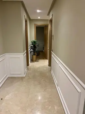 a hallway of a home with a tile floor at Appartement convivial in Rabat