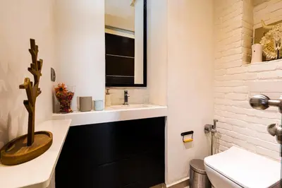 a bathroom with a sink and a toilet at Luxury Duplex with Home Cinema Central Casablanca in Casablanca