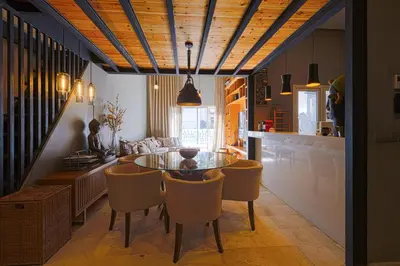 a dining room with a glass table and chairs at Luxury Duplex with Home Cinema Central Casablanca in Casablanca