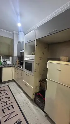 a kitchen with a refrigerator and a stove at Cozy Sunny Apartment Near Beach nd Local Amenities in Dar Ben Abdallah Ben Dehbi