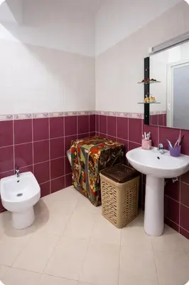 a bathroom with a toilet and a sink at Spacious Family-Friendly Apartment in Temara