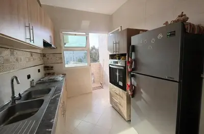 a kitchen with a stainless steel refrigerator and a sink at Spacious Family-Friendly Apartment in Temara
