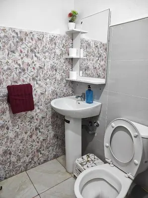 a bathroom with a toilet and a sink at appart a 5min de l'hôpital Mohamed 6 in Casablanca