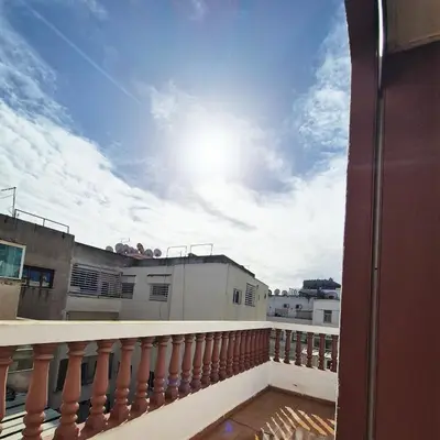 a balcony with a view of the sky at Appartement familial au quartier des Hôpitaux in Casablanca