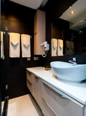 a bathroom with a sink and a mirror at The Fourteen Luxury Boutique Hotel & SPA in Casablanca