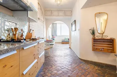a large kitchen with a counter and a mirror at Charming Moroccan Studio, Breathtaking View in Casablanca