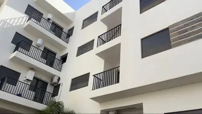 an exterior view of a building with balconies at Apartment avec piscine terrasse et balcon in Bouznika