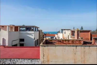 a view of a city from the roofs of buildings at Villa à harhora in Temara