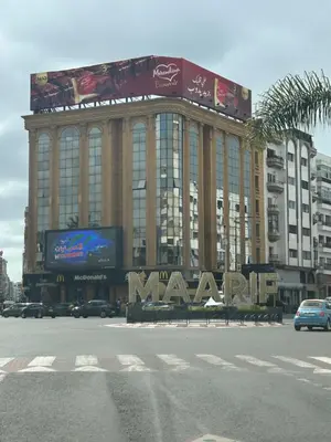 a large building with a large sign in front of it at Evasion chic et central au coeur de Maarif in Casablanca
