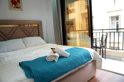 a bed with a towel and a stuffed animal on it at Evasion chic et central au coeur de Maarif in Casablanca