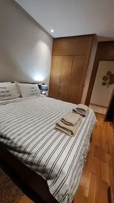 a bedroom with a bed with towels on it at Luxury Appart Finance City in Casablanca