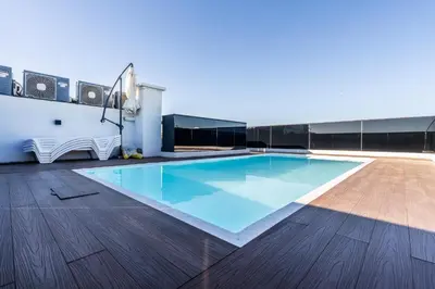 a swimming pool on the roof of a building at Luxury one bedroom in Triangle d'or with rooftop pool in Casablanca