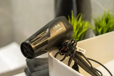 a blow dryer sitting on top of a table at Luxury one bedroom in Triangle d'or with rooftop pool in Casablanca