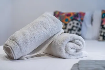 a towel animal is laying on a table at Luxury one bedroom in Triangle d'or with rooftop pool in Casablanca