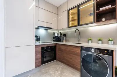 a kitchen with a washer and a dishwasher at Luxury one bedroom in Triangle d'or with rooftop pool in Casablanca