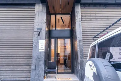 a entrance to a building with a bus parked outside at Luxury one bedroom in Triangle d'or with rooftop pool in Casablanca