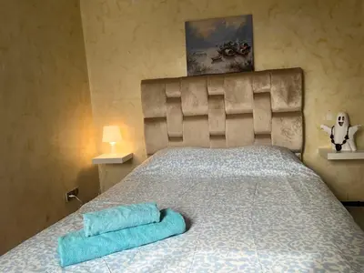 a bedroom with a bed with two towels on it at Chambre Cosy - Accès Côte et Plage Mohammedia, Centre-Ville Mohammedia à Pied - Résidence 3 Mars in Mohammedia