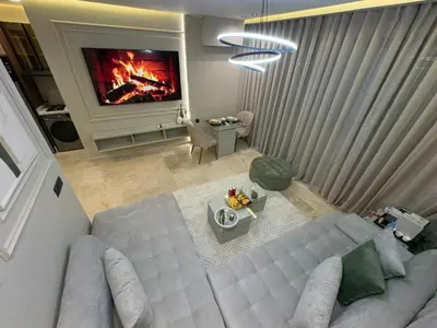 an overhead view of a living room with a couch and a tv at Premium Studio Oasis Secure Parking High Speed Fiber Wifi Luxoria Oasis Residence Near CFC & 70p Smart TV in Casablanca