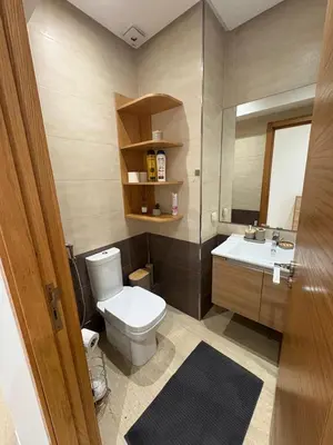 a bathroom with a toilet and a sink at Premium 2 Bedroom Suite Maarif Central & High-Speed Wi-Fi Fully Equipped Walk to Twin Center & Shops Next to Carrefour Val Fleuri Family-Friendly in Casablanca