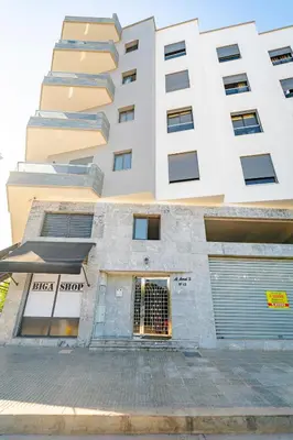 a building with a gate in front of it at Studio Balcony Netflix, Near CFC, Parking in Casablanca
