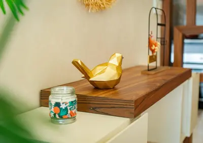 a wooden counter with a gold shoes on it at Studio Balcony Netflix, Near CFC, Parking in Casablanca
