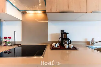 a kitchen with a tray of coffee mugs on a counter at CFC Elegance & Terrace & Fitness & Parking in Casablanca