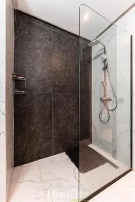 a shower with a glass door in a bathroom at CFC Elegance & Terrace & Fitness & Parking in Casablanca