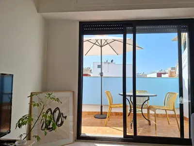 a dining room with a table and an umbrella at Private and sunny apartment in central Casa in Casablanca