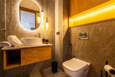 a bathroom with a sink and a toilet and a mirror at Studio chic & moderne - Les Princesses - Parking in Casablanca