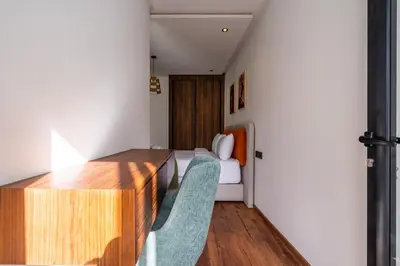 a room with a bed and a table and chairs at Résidence Happy Living in Casablanca