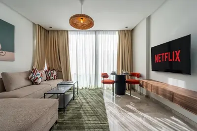 a living room with a couch and a table at Résidence Happy Living in Casablanca