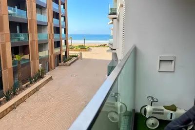 an apartment balcony with a view of the beach at Maya Suites - Anfa Place - Sea View in Casablanca
