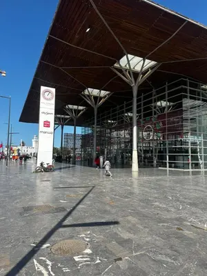 a large building with awning in a parking lot at Appartement centre casablanca in Casablanca