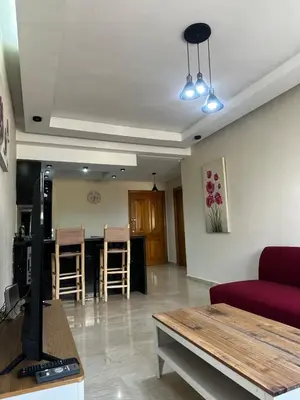 a living room with a couch and a table at Appartement centre casablanca in Casablanca