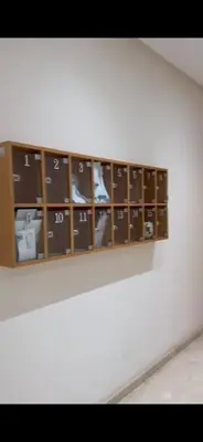 a shelf with many objects in it on a wall at Appart luxe in Rabat