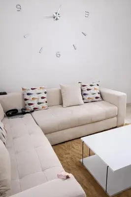 a white living room with a white couch at Diamonds in Rabat