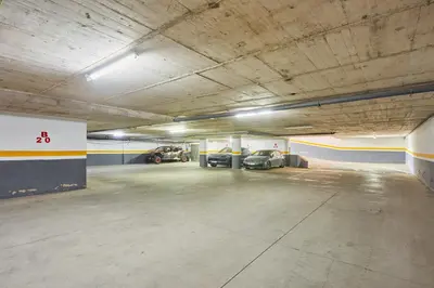 a parking garage with two cars parked in it at Bright Studio at Bliving with Sunny Terrace 1 BR in Casablanca