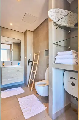 a bathroom with a toilet and a sink at Sunlit loft with terrace-B living 1 Br in Casablanca