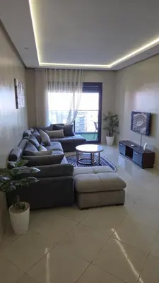 a living room with a couch and a table at Casa Downtown Modern Studio in Casablanca