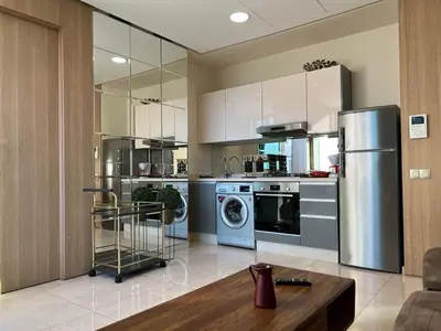 a kitchen with a stainless steel refrigerator and a dishwasher at Anfaflore2 in Casablanca