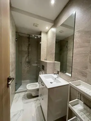 a bathroom with a sink and a toilet and a mirror at Anfaflore2 in Casablanca