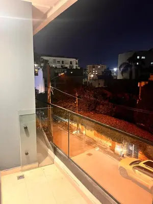 a balcony with a view of a city at night at Apartment for rent in the heart of Casablanca in Maarif
