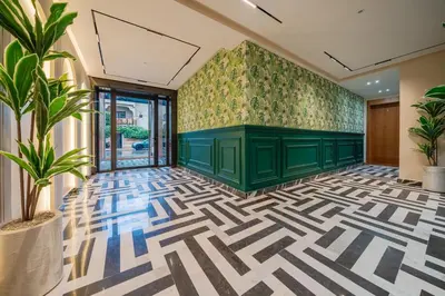 a lobby with a green room with a geometric floor at New Cosy 1BR Autonome Fibre by- Global Home Stay in Casablanca