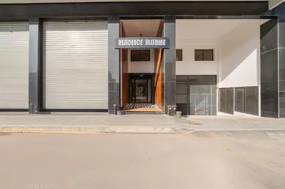 a building with a sign that reads healthcare institute at New Cosy 1BR Autonome Fibre by- Global Home Stay in Casablanca