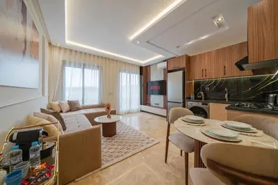 a living room with a couch and a table at New Cosy 1BR Autonome Fibre by- Global Home Stay in Casablanca