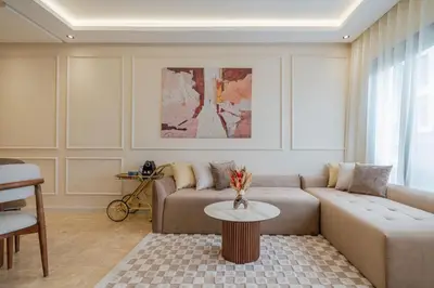 a living room with a couch and a table at New Cosy 1BR Autonome Fibre by- Global Home Stay in Casablanca